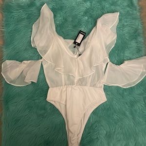 Size 4 white top. One piece with mesh material.